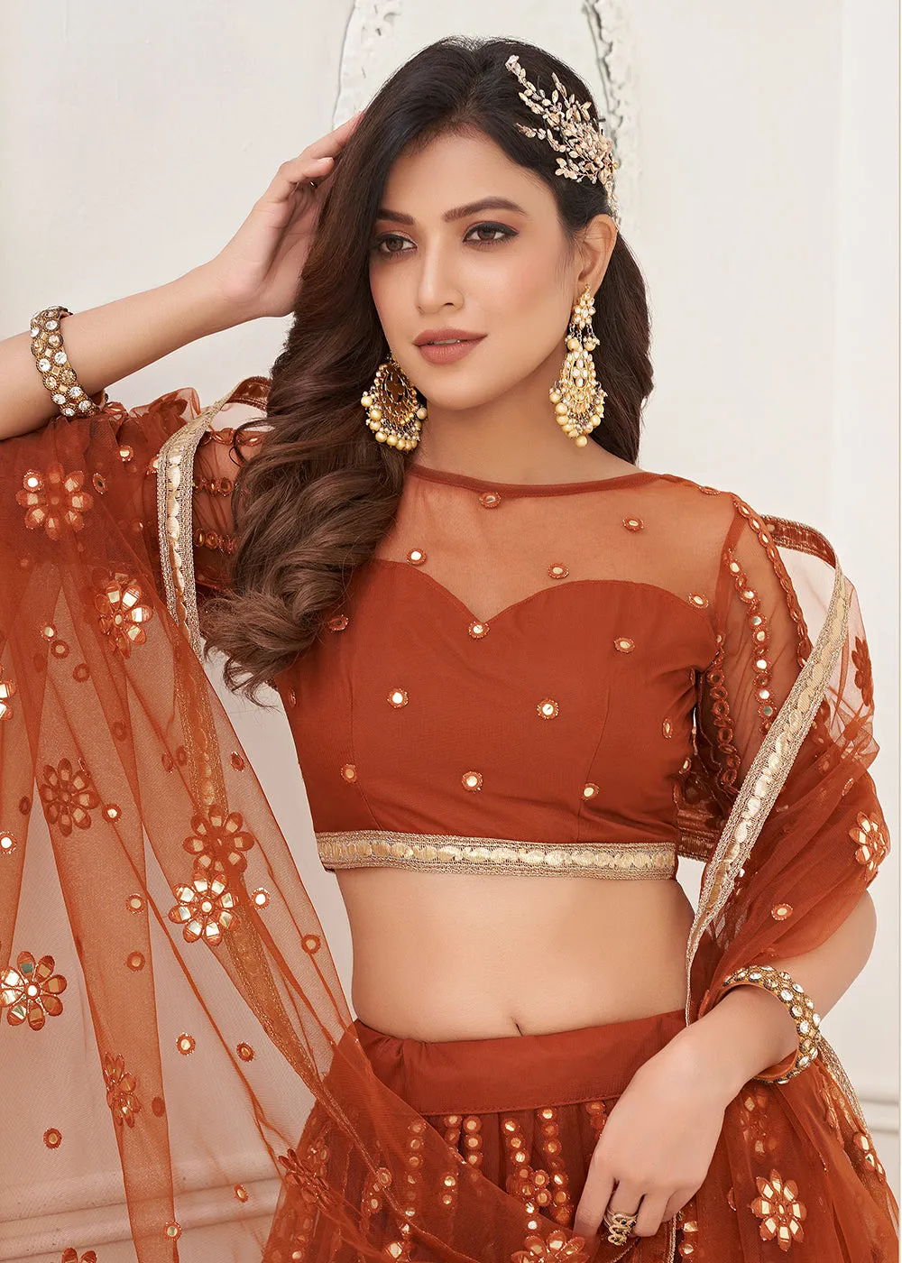 Embroidered Net Rust Sangeet & Wedding Wear Lehenga Choli