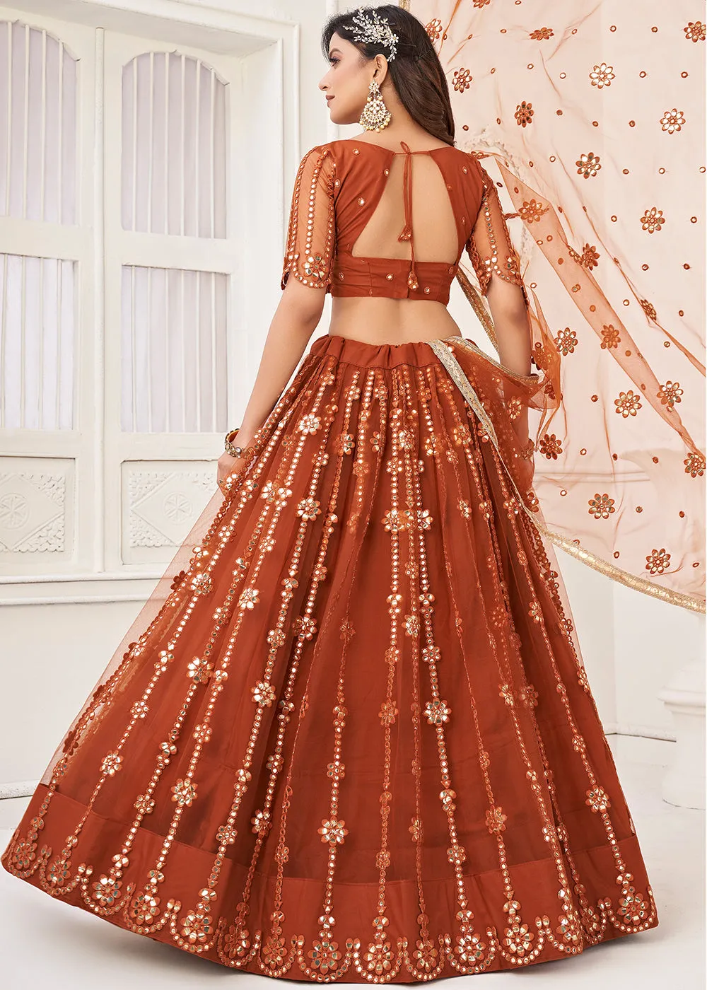 Embroidered Net Rust Sangeet & Wedding Wear Lehenga Choli