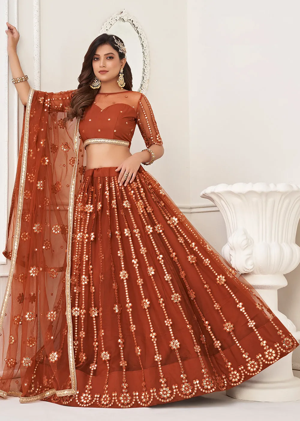 Embroidered Net Rust Sangeet & Wedding Wear Lehenga Choli